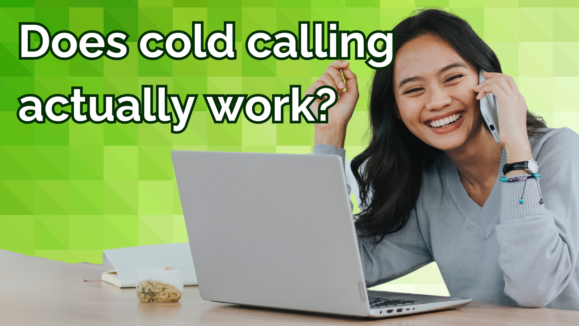 woman smiling on phone, does cold calling actually work?